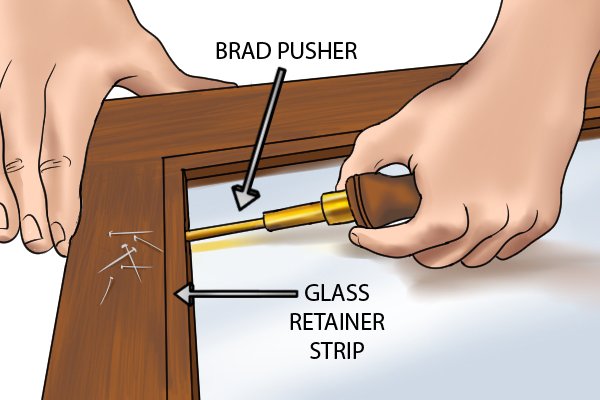 A brad pusher in use on a frame