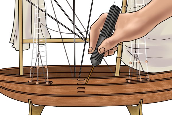 Pin pusher in use on a model ship