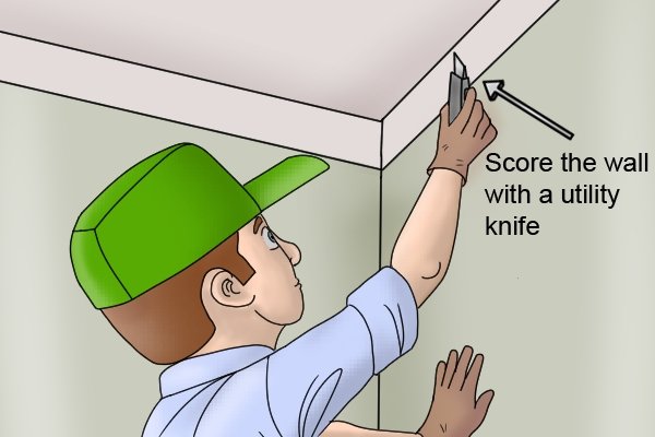 Score the walls with a utility knife to help the adhesive stick.