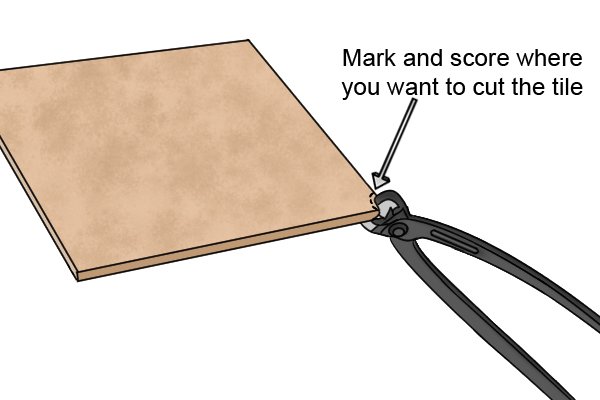 Mark and score where you want to cut the tile.