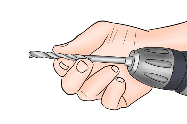 The drill bit is secured in the chuck of the hand drill by turning the shell of the chuck in a clockwise direction