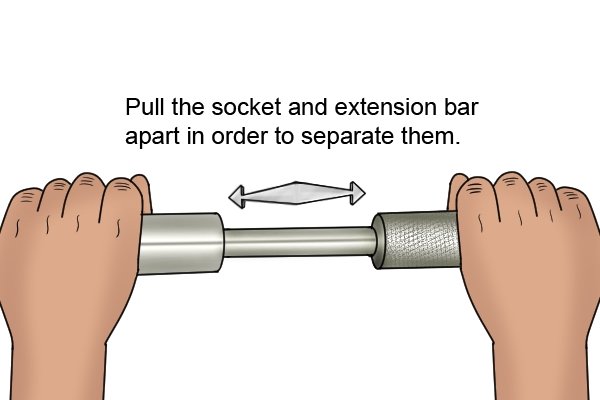 Separating a socket from an extension bar, Holding the socket in one hand and the end of the extension bar in the other. Pull the two apart in order to separate them.