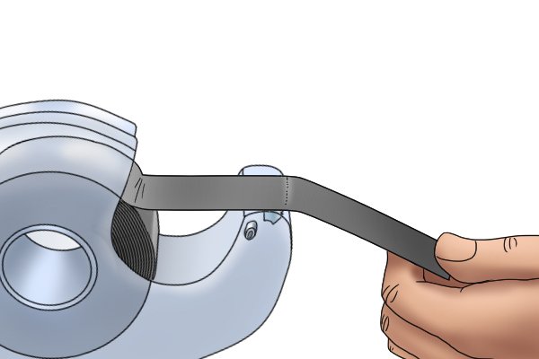 Using a flexible magnetic tape dispenser 