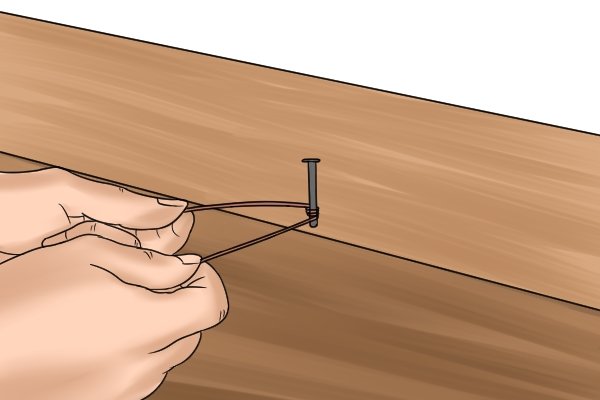 Plumb bob checking for plumb fix a nail in and attach string wonkee donkee tools DIY guide how to use a plumb bob