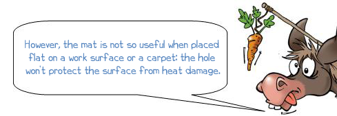 Wonkee Donkee says 'However, the mat is not so useful when placed flat on a work surface or a carpet: the hole won't protect the surface from heat damage.'