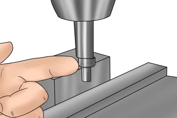 When the edge finder makes contact with the edge, the two cylindrical parts will become offset. 