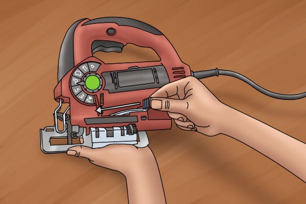 Loosen jigsaw shoe adjustment lever