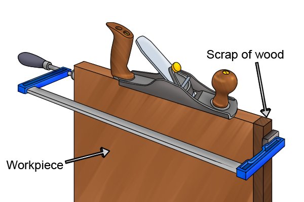 Use a scrap of wood to avoid tear out