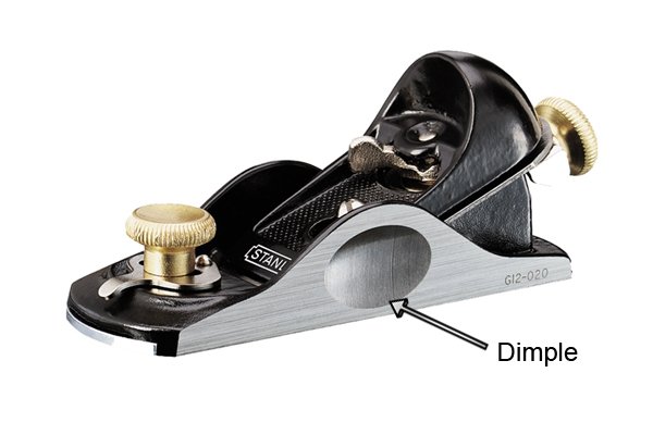The dimple of a metal block plane