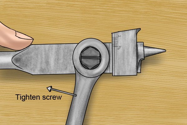 Image of a DIYer tightening up an adjuster screw on an expansive bit