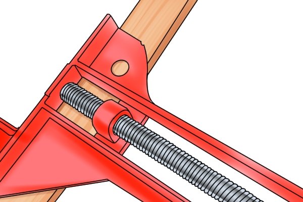 An angle clamp has a large threaded screw