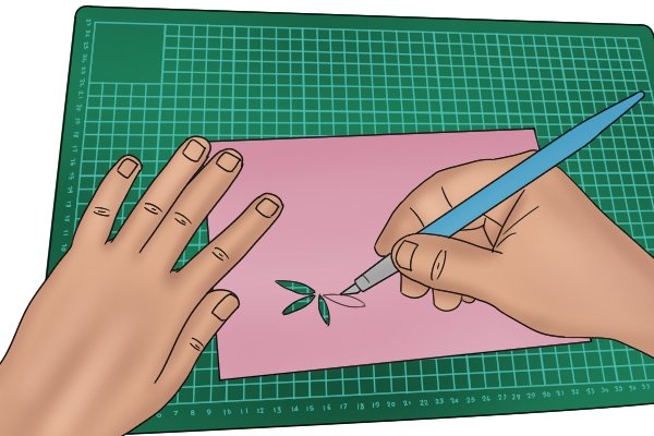 Cutting out paper with a craft knife