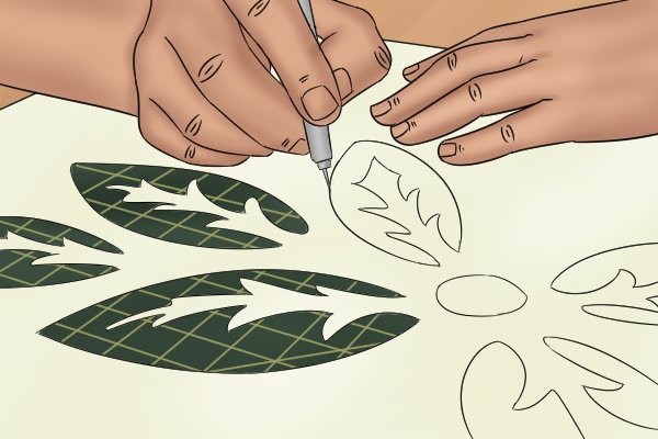 Gently cut out the stencil design using your craft knife