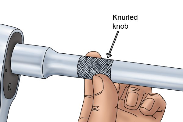 Fasten knurled knob by rotating it