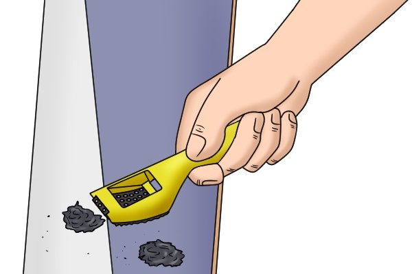 A surform shaver is commonly used for smoothing down paint or filler
