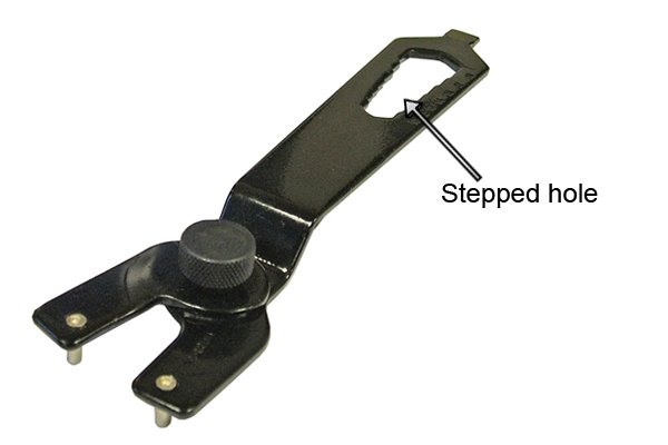 Pin spanner with stepped hole for turning normal nuts.