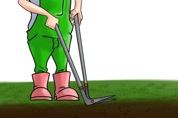 Using edging shears on lawn