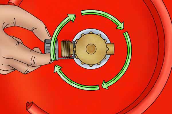 Turning cylinder valve handwheel clockwise to make sure gas is off 