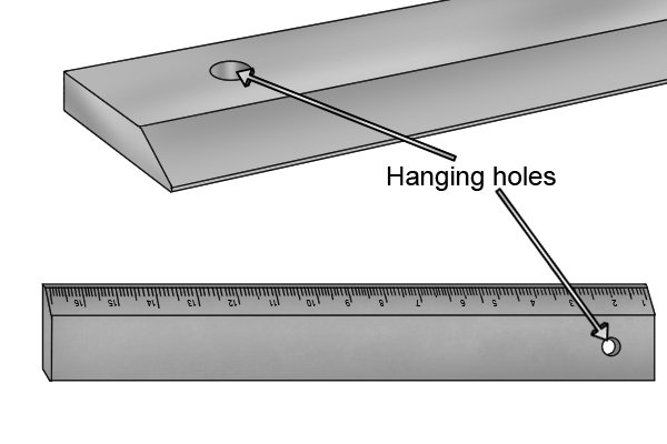 Hanging holes on a knife edge engineer's straight edge are used to store the straight edge