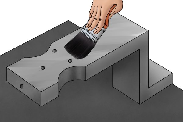 Use a soft bristled brush to remove any dirt or swarf from the surface of the workpiece before you begin scraping