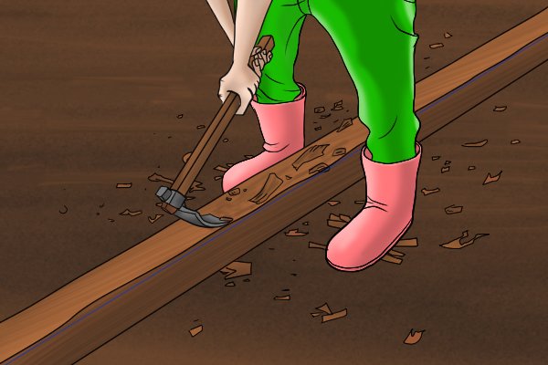 Image of a DIYer levelling off the lumps and bumps in a wooden beam