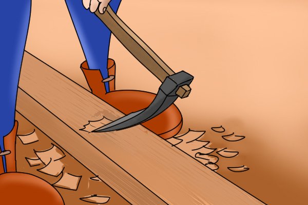 Image of a DIYer using diagonal strokes to plane wood