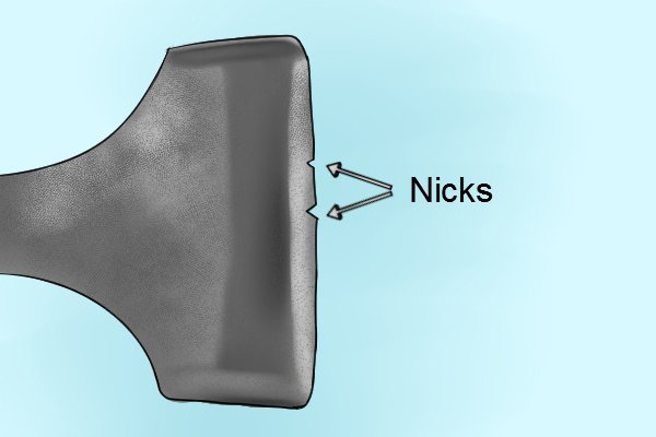 Image of an adze blade with nicks