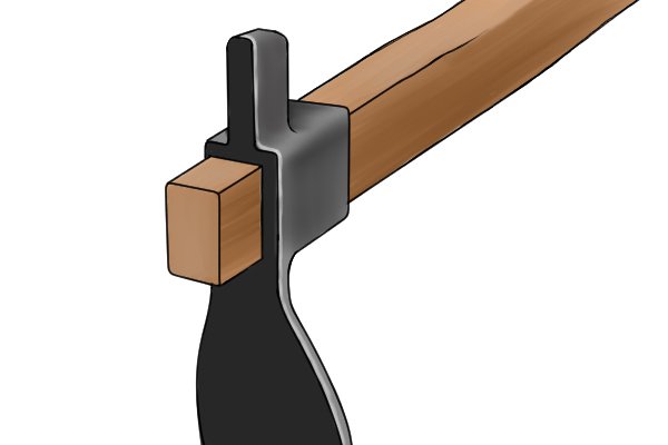 Image to illustrate how an adze head is wedged onto the handle