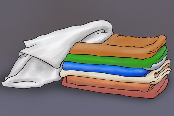 Image of a stack of towels ready to be laid down to prevent water damage to a DIYer's flooring
