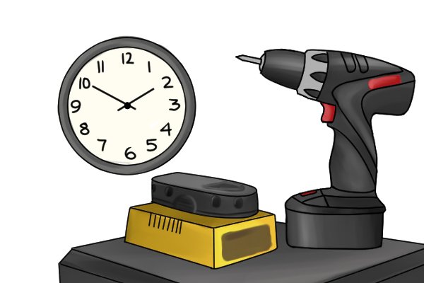 Clock with a cordless drill driver and its battery charging