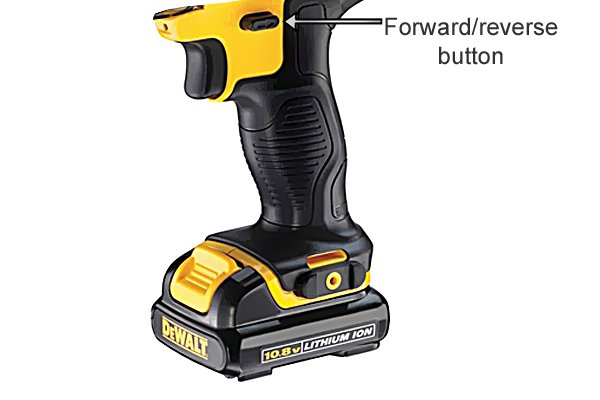 Forwards/reverse button on a cordless drill driver
