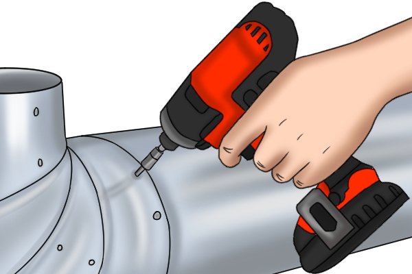 Cordless impact driver working on a metal pipe