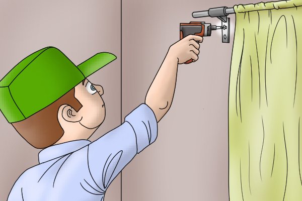 Using a cordless screwdriver to put up curtain rail