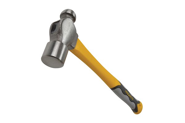 A ball pein hammer being used on a cold chisel