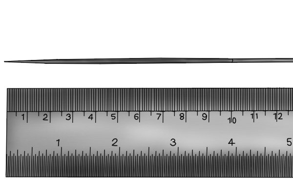 Image of a needle file against a steel rule showing that the tool is usually around 100mm long