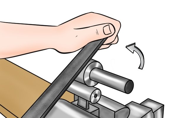 Image showing a DIYer replacing their flat file in the position where they originally started their push stroke while filing a convex surface
