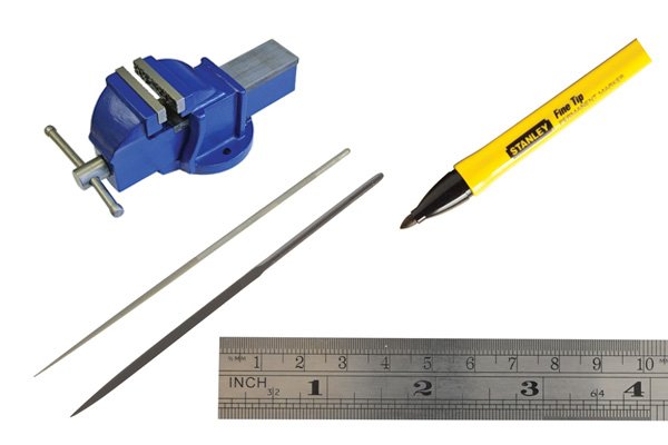 Image of a vice, marker pen, steel rule, round needle file and three square needle file which are all used in creating a vine filework pattern on the back of a knife blade