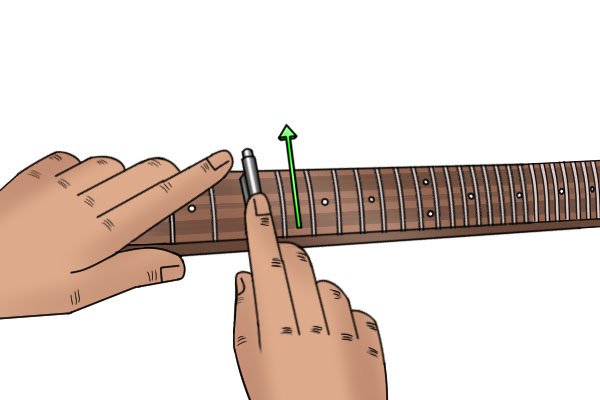 Image of a DIYer filing with a fret end dressing file