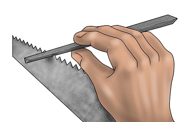 DIYer sharpening a rip saw with a taper saw file