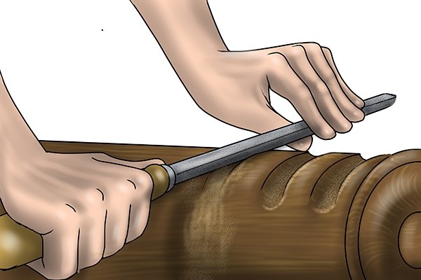 Image of a DIYer using a half round file to create a curved groove