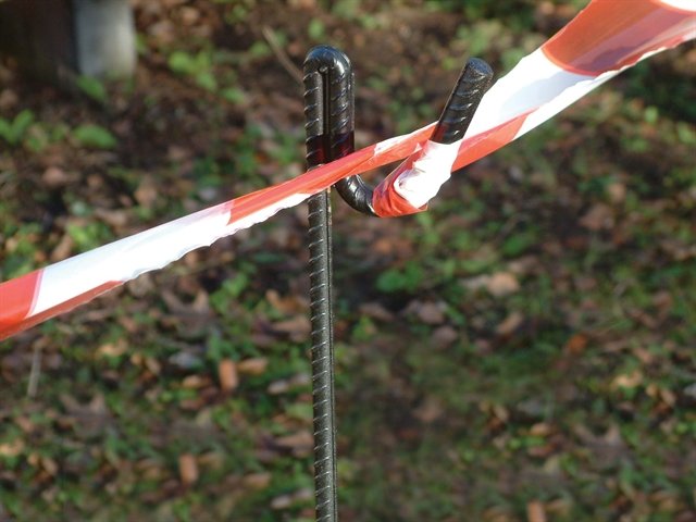 Looped tape around a fencing pin