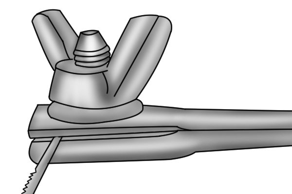 When the blade is sitting straight, turn the wing nuts in a clockwise direction to tighten the blade. 