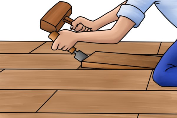 Once the joint has been cut, you can prise up the floorboard using a wide chisel. 