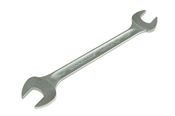 Double ended spanner with open head at either end
