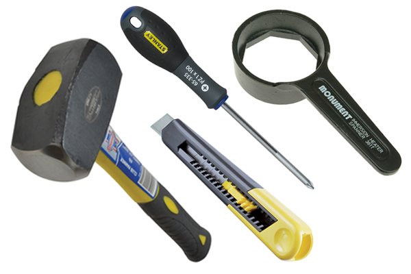 Image of the tools required for removing an immersion heater element including an immersion heater spanner, hammer, screwdriver and Stanley knife