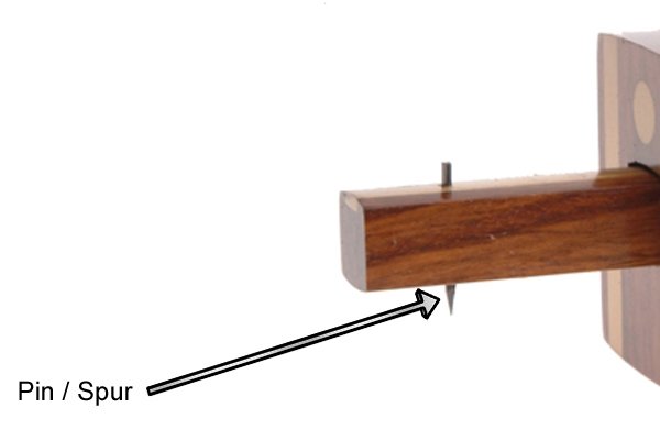 Parts of a marking gauge; pin / spur, used to mark the wood when dragged across by the user