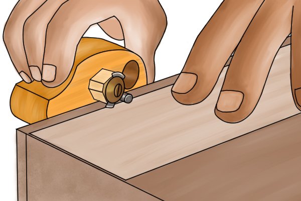 Cutting thin veneer wood with a cutting gauge using a small knife