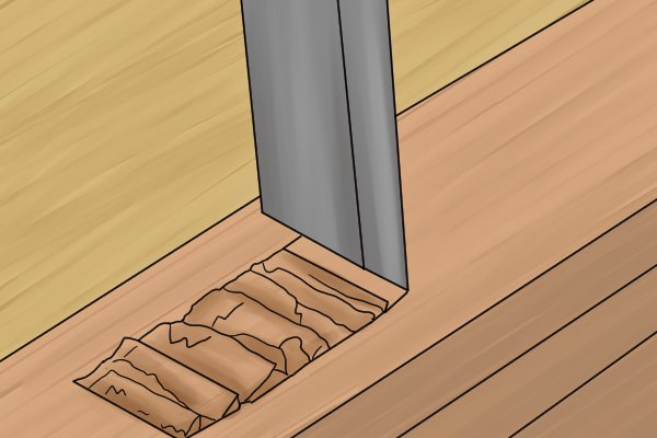Chiselling out a mortise in wood, marked out by a mortise marking gauge