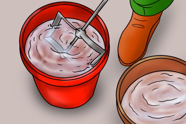 Place the head of the paddle into the bucket of hot soapy water, so that the portion with material stuck to it is below the surface of the water. 