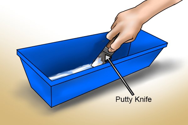 Use a putty knife to scour the hardened plaster
